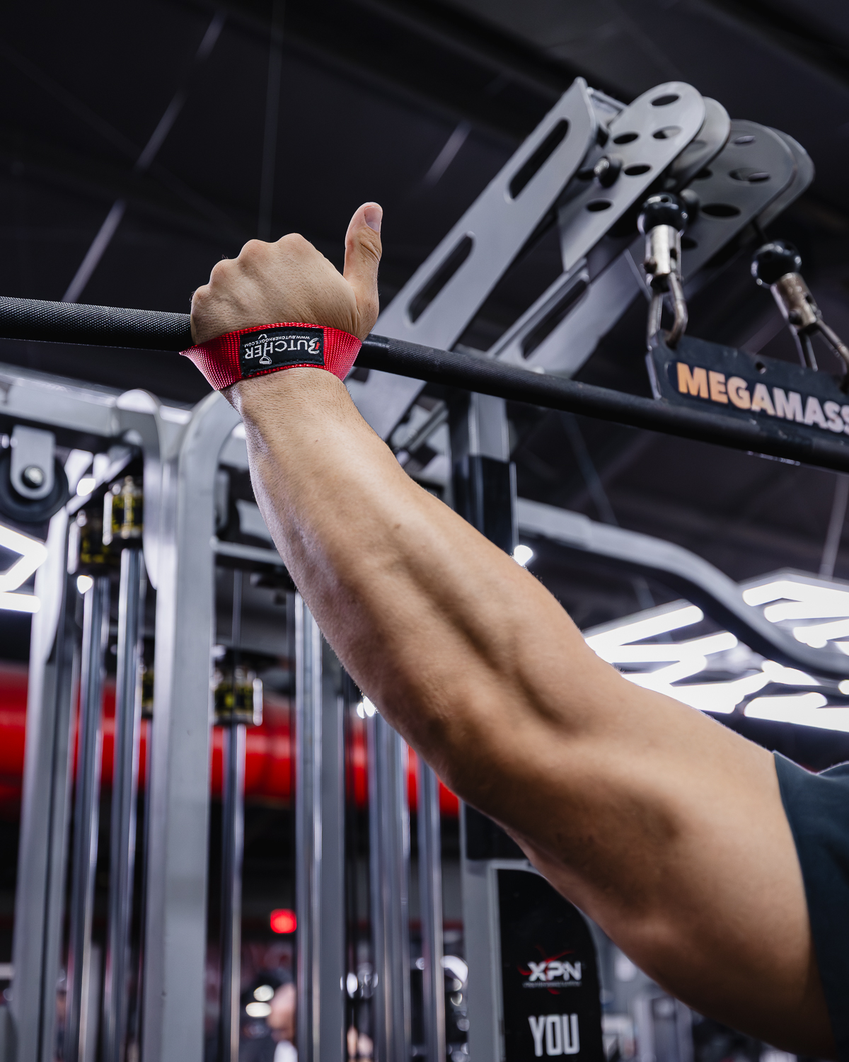 Red Butcher lifting strap gripping a cable bar